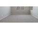 Spacious bedroom with neutral carpeting and natural light at 23148 E Carriage Way, Queen Creek, AZ 85142