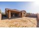 View of the back of the house and yard at 23148 E Carriage Way, Queen Creek, AZ 85142
