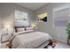 Bright bedroom featuring a queen-size bed and large window at 23148 E Carriage Way, Queen Creek, AZ 85142