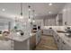Open concept kitchen with a large island, stainless steel appliances, and plenty of storage at 23148 E Carriage Way, Queen Creek, AZ 85142