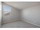 Spacious bedroom with neutral decor and large window at 23148 E Carriage Way, Queen Creek, AZ 85142