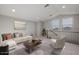 Bright living room with modern furniture and a view at 23148 E Carriage Way, Queen Creek, AZ 85142