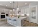 Modern kitchen with large island, stainless steel appliances, and ample cabinetry at 23148 E Carriage Way, Queen Creek, AZ 85142