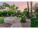 Landscaped backyard with a fire pit and seating area at 2069 E Cedar Pl, Chandler, AZ 85249