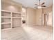 Bright bedroom with large windows, ceiling fan, and built-in shelves at 2069 E Cedar Pl, Chandler, AZ 85249