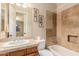 Well-appointed bathroom with a shower/tub and wood vanity at 2069 E Cedar Pl, Chandler, AZ 85249