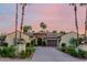 Luxury home exterior with palm trees and landscaping at 2069 E Cedar Pl, Chandler, AZ 85249