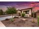 Single story home with attractive landscaping and two-car garage at 17135 W Diana Ave, Waddell, AZ 85355