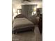 Spacious bedroom with a plush bed and tiled floor at 9627 W North Ln # B, Peoria, AZ 85345