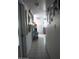 Bright hallway with tiled floors and mirrors at 9627 W North Ln # B, Peoria, AZ 85345