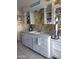 Kitchen with double sink, floral wallpaper, and open shelving at 9627 W North Ln # B, Peoria, AZ 85345