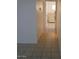 Clean hallway with tiled floors at 9627 W North Ln # B, Peoria, AZ 85345