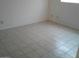 Empty bedroom with tiled floors and neutral walls at 9627 W North Ln # B, Peoria, AZ 85345