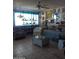 Bright living room with tiled floors, comfy seating, and large window at 9627 W North Ln # B, Peoria, AZ 85345