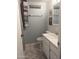 Clean bathroom with white vanity, tiled floor, and shower at 9627 W North Ln # B, Peoria, AZ 85345