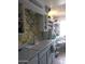 Kitchen features floral backsplash and ample storage at 9627 W North Ln # B, Peoria, AZ 85345