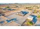 Aerial view of property showing house, arena, and surrounding desert landscape at 12942 S 192Nd Ave, Buckeye, AZ 85326