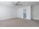 Bright bedroom featuring neutral carpet and an ensuite bathroom at 12942 S 192Nd Ave, Buckeye, AZ 85326