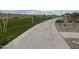 Concrete walking path winds through the community landscape at 15788 W Mariposa Grande Ave, Surprise, AZ 85387