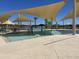 Community kiddie pool with water features and shade structures at 15788 W Mariposa Grande Ave, Surprise, AZ 85387