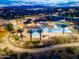 Night view of community pool and surrounding area at 15788 W Mariposa Grande Ave, Surprise, AZ 85387