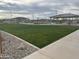 Community park with covered picnic areas and grassy lawn at 15788 W Mariposa Grande Ave, Surprise, AZ 85387