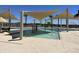 Community kiddie pool with water features and shade structures at 15788 W Mariposa Grande Ave, Surprise, AZ 85387