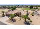 Single-story home with desert landscaping, golf course view, and a large backyard at 15717 W Linksview Dr, Surprise, AZ 85374