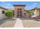 House exterior with decorative double doors and landscaping at 15717 W Linksview Dr, Surprise, AZ 85374