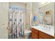 Guest bathroom with tub/shower combination and wood vanity at 15717 W Linksview Dr, Surprise, AZ 85374