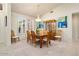 Elegant dining room with a crystal chandelier and hardwood table at 15717 W Linksview Dr, Surprise, AZ 85374