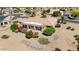 Single story home with a large backyard, and lush landscaping at 15717 W Linksview Dr, Surprise, AZ 85374