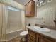 Clean bathroom with a shower/tub combo and wood vanity at 650 N Hawes Rd # 4956, Mesa, AZ 85207