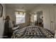 Bright bedroom with a comfortable chair and a large window at 650 N Hawes Rd # 4956, Mesa, AZ 85207