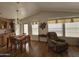 Light and bright dining area with wood floors and a view to backyard at 650 N Hawes Rd # 4956, Mesa, AZ 85207