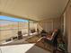 Covered patio with comfortable seating and a view of the community at 650 N Hawes Rd # 4956, Mesa, AZ 85207
