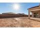 Large backyard with covered patio and block wall at 16399 W Avenida Del Sol --, Surprise, AZ 85387