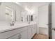 Double vanity bathroom with sleek design and updated fixtures at 16399 W Avenida Del Sol --, Surprise, AZ 85387