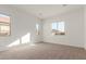 Bright bedroom with neutral carpeting and large windows at 16399 W Avenida Del Sol --, Surprise, AZ 85387