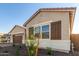 House exterior with brown shutters and landscaping at 16399 W Avenida Del Sol --, Surprise, AZ 85387