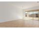 Bright living room featuring sliding glass doors to backyard at 16399 W Avenida Del Sol --, Surprise, AZ 85387