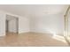 Spacious living room with light wood floors and large windows at 16399 W Avenida Del Sol --, Surprise, AZ 85387