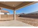 Covered patio overlooking a large backyard at 16399 W Avenida Del Sol --, Surprise, AZ 85387