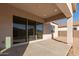 Covered patio with sliding glass doors and backyard view at 16399 W Avenida Del Sol --, Surprise, AZ 85387