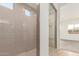 Modern shower with neutral tile and glass enclosure at 16399 W Avenida Del Sol --, Surprise, AZ 85387