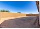 Empty dirt backyard with a tan brick wall at 21726 E Lords Way, Queen Creek, AZ 85142