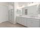 Main bathroom with double vanity, walk-in shower, and modern fixtures at 21726 E Lords Way, Queen Creek, AZ 85142