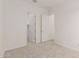 Spacious bedroom showcasing plush carpeting, white walls, and entry to a walk-in closet at 21726 E Lords Way, Queen Creek, AZ 85142