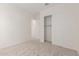 Additional bedroom with neutral carpet and a sliding closet door at 21726 E Lords Way, Queen Creek, AZ 85142