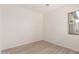 Bedroom with wood-look flooring and a large window at 21726 E Lords Way, Queen Creek, AZ 85142